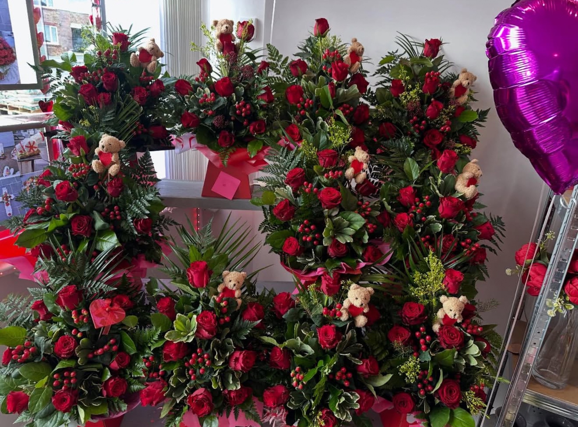 Valentine's red rose standing sprays with teddy bears