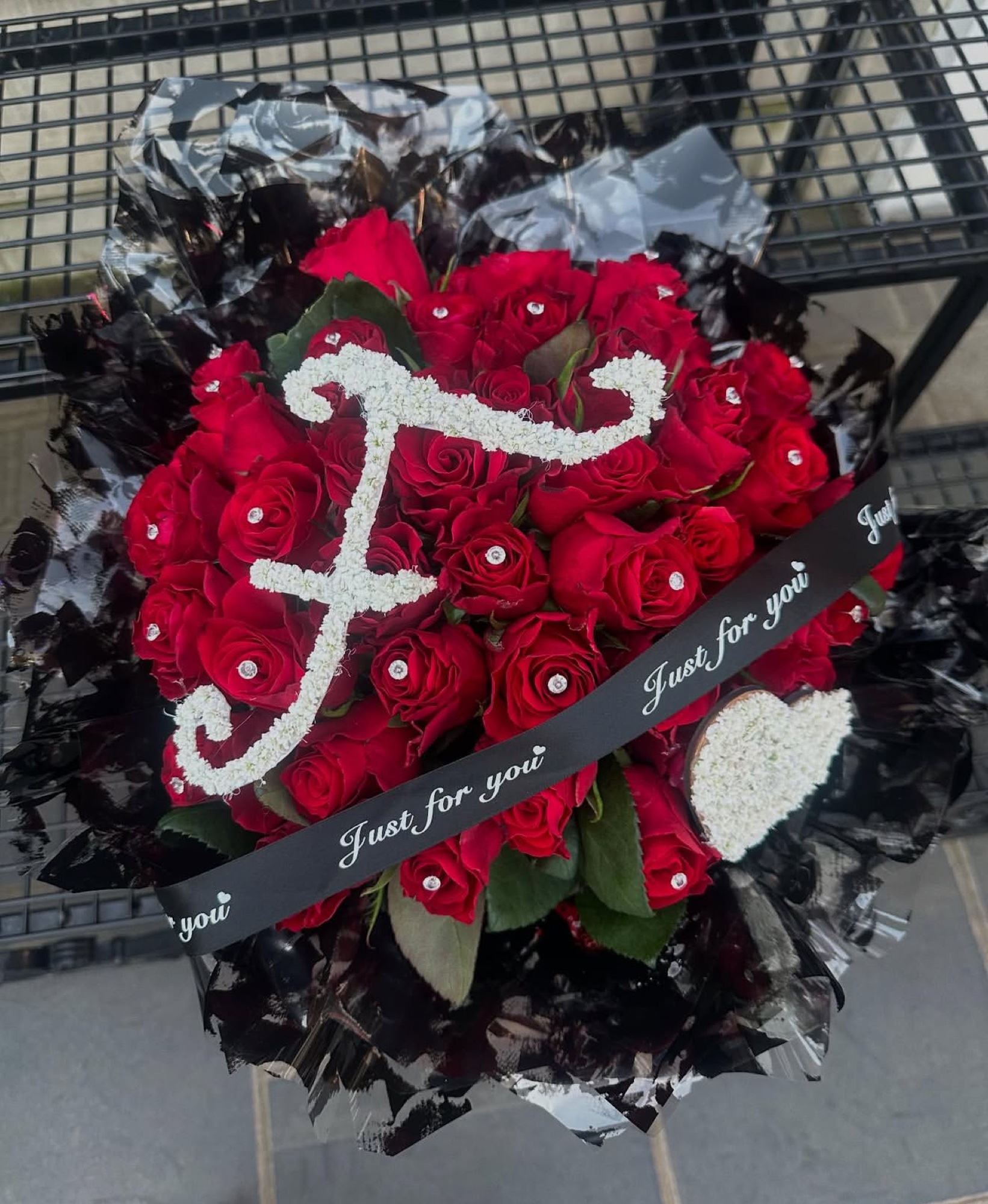 J monogram bouquet of red roses with Just for you ribbon